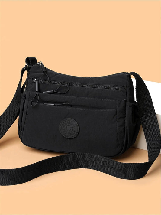 Hold orden på farten: Letvægts crossbody-taske med 5 smarte lynlåslommer ✨👜
